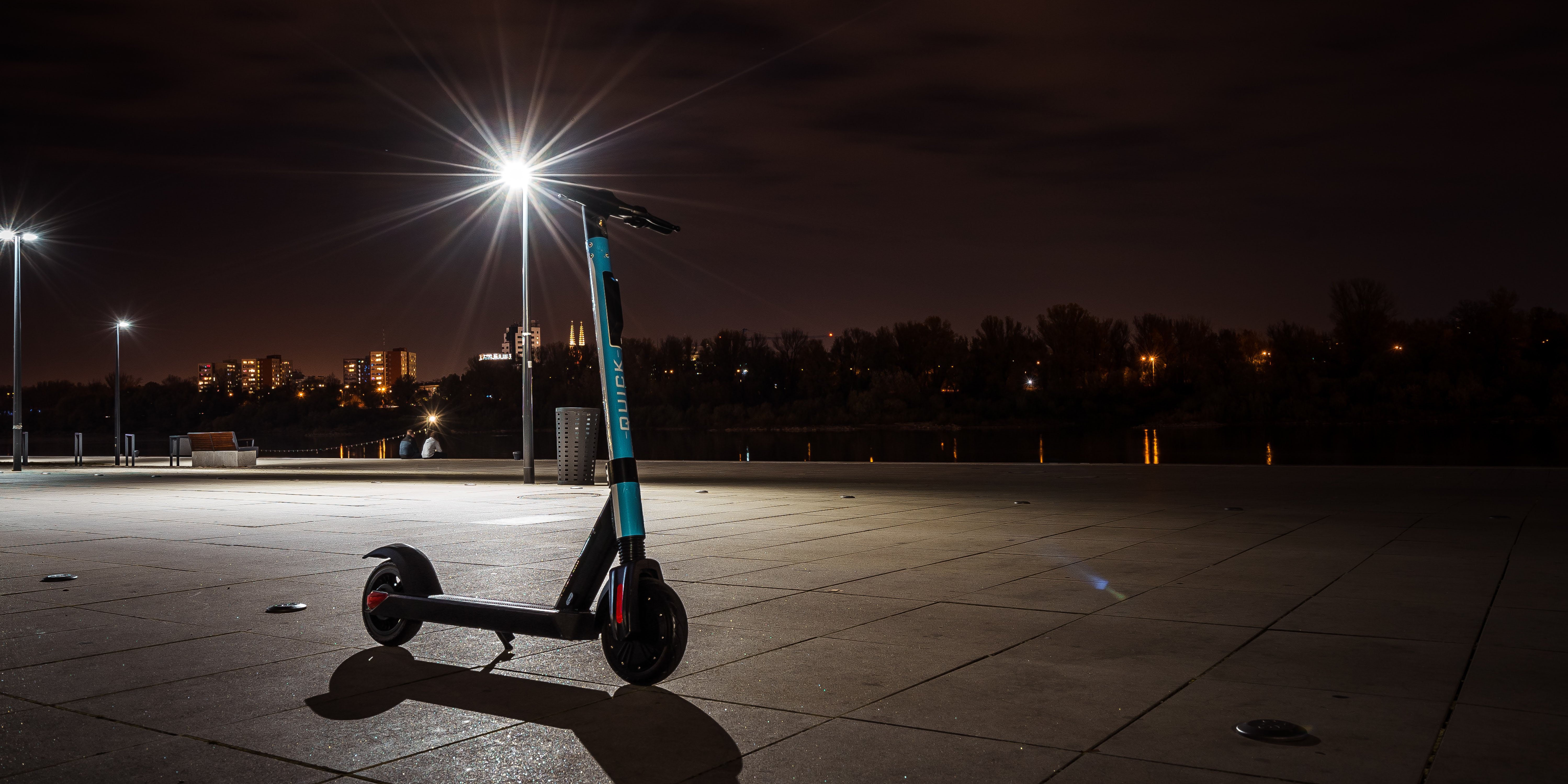A solitary scooter in the dark