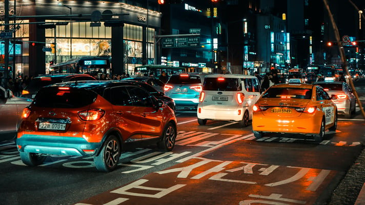 Cars on a city road at night