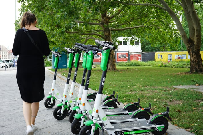 Woman-walking-past-scooters